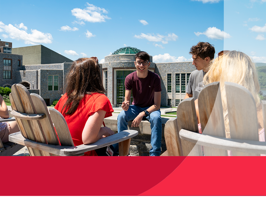 Students chatting outdoors on campus.
